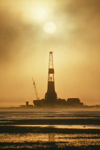 Oil rig on Prudhoe Bay at sunset