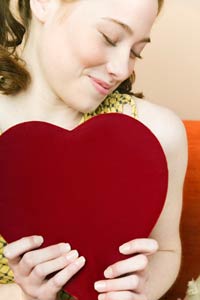 blushing girl holding heart