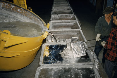 Molten aluminum in pots ready to be poured