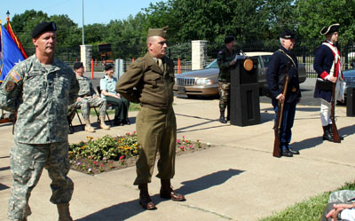 Re-enactors from the Kansas Army National Guard represent four periods of conflict in the history of the U.S. Army during the 231st Army Birthday ceremony: the Revolutionary War, the Civil War, World War II and the Global War on Terrorism.