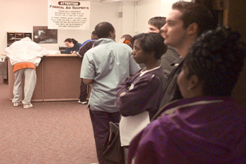 Students waiting in line at financial aid office. 