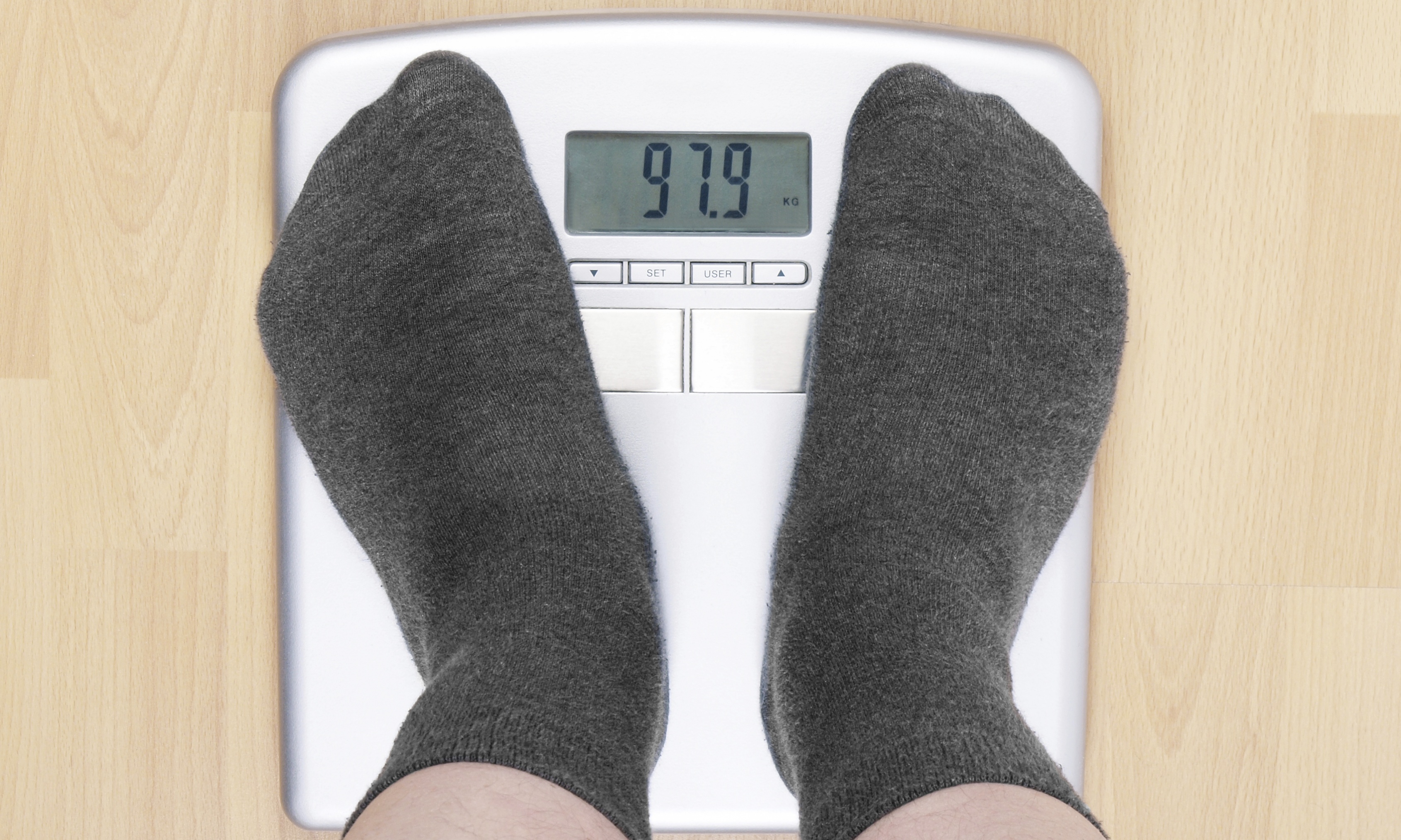 A) Use of a commercially available digital weight scale incorporating