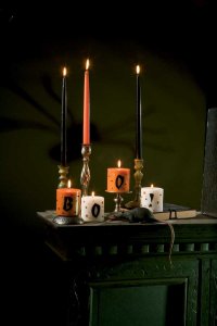 Create a spooky scene with these ghoulish candles.