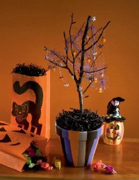 You can turn an ordinary tree branch into a spooky Halloween tree.