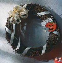 Make a plan grapevine wreath into a fun Halloween decoration with our easy instructions for a Halloween wreath.