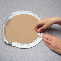 Wrap the foil around the edges of our cardboard circle.