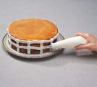 # Use left hand to rotate cake plate as you pipe on horizontal strips.