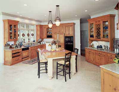 Elegant yet casual, this French country kitchen utilizes angled walls and a kitchen island for a dramatic look.