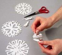 Experiment with various cuts to produce differently shaped snowflakes. 