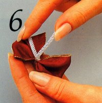 In step 6, tie a chenille stem around the center of the bow.