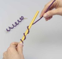 Wrap the purple beads around a pencil to form a loose coil.
