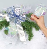 Attach the tissue paper to the floral pick and insert them into the wreath.