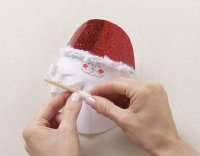 Curl each strips around paintbrush.