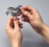 Glue bow to butter mold ornament.
