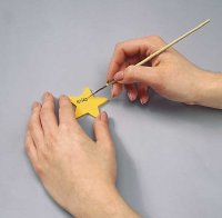 Paint words onto star. Then, glue on the berries.