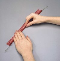 After rolling fabric around wire, braid strips, and then bend into a candy cane.