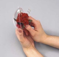 Glue the carnation arrangement to the to the plastic egg.