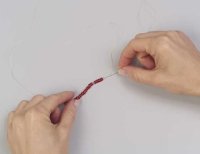 Begin stringing beads on the thread.