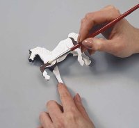 Use brown paint to create the pinto markings.