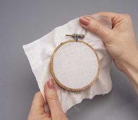 Place the muslin into the frame.
