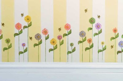 Flowers and bees line the walls, making a summery border.