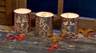 Draw shapes onto the cans to make your own Halloween candles.