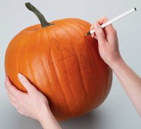 Use a pen to connect the dots when carving a pumpkin.