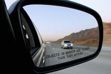 The Reason Why Objects in a Car's Side-View Mirror Are Closer Than