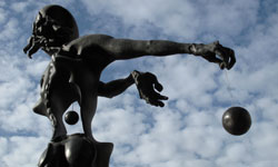 Designed by Salvador Dali, this bronze statue depicts a surreal Isaac Newton holding a sphere that represents the center of the universe.